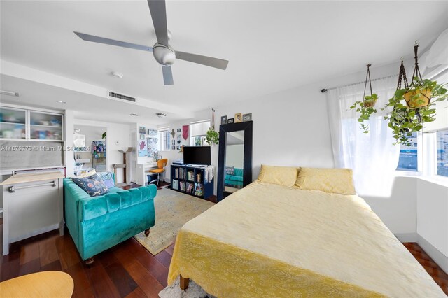 bedroom featuring ceiling fan and dark hardwood / wood-style floors