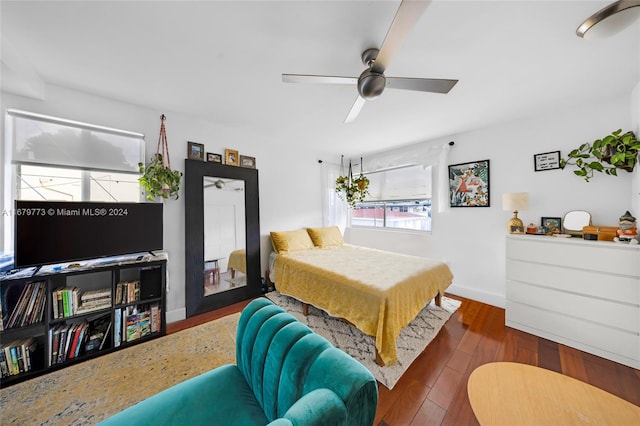 bedroom with dark wood-type flooring and ceiling fan