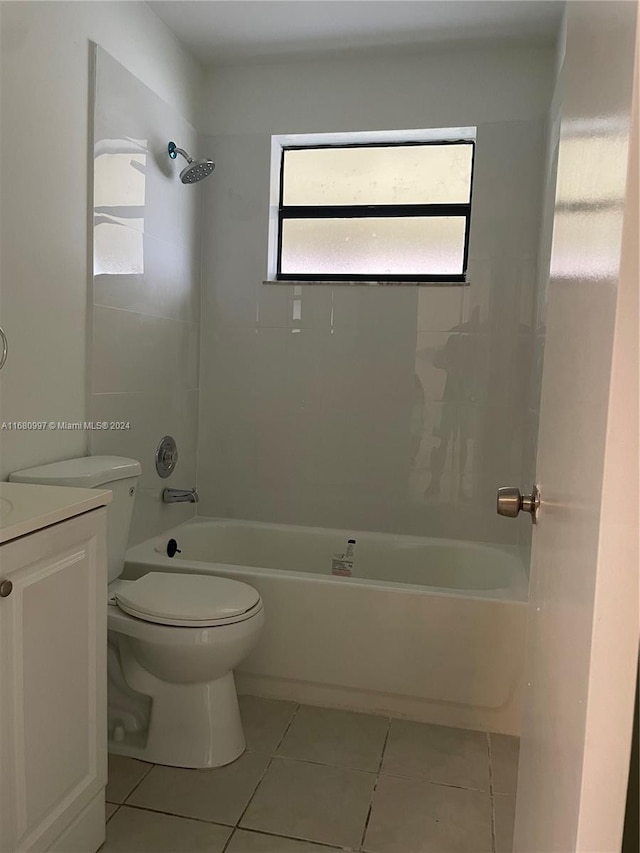 full bathroom with vanity, toilet, tiled shower / bath combo, and tile patterned flooring