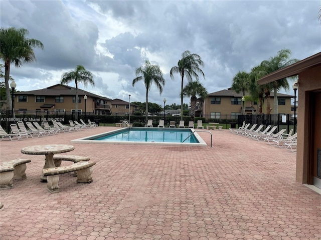 view of swimming pool with a patio area