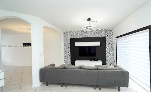 living room with a healthy amount of sunlight and light tile patterned floors