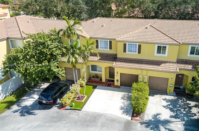 mediterranean / spanish home featuring a garage