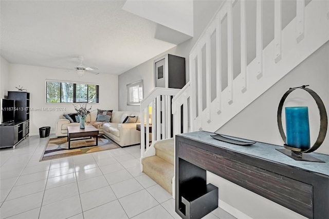 tiled living room featuring ceiling fan