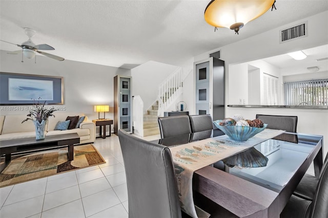 428 SE 11th Ter, Dania Beach, FL 33004 - tiled dining room featuring stairway and a ceiling fan