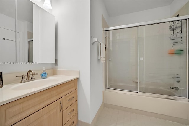 428 SE 11th Ter, Dania Beach, FL 33004 - full bath with bath / shower combo with glass door, vanity, and baseboards