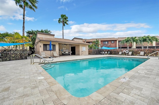 view of pool featuring a patio area and ceiling fan