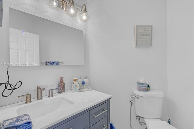 bathroom with vanity and toilet