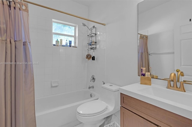 full bathroom with vanity, shower / tub combo, and toilet