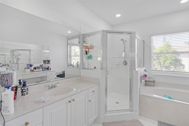 bathroom featuring tile patterned floors, vanity, and separate shower and tub