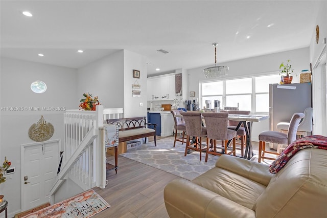 living room with light hardwood / wood-style flooring