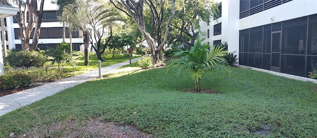 view of yard with a sunroom