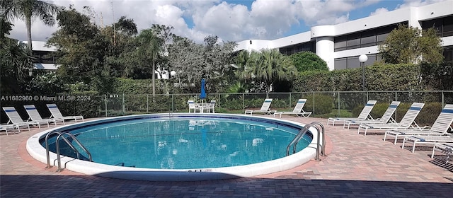 view of pool featuring a patio area