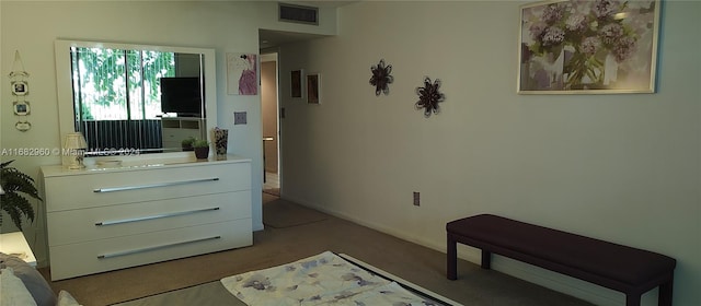 bedroom featuring light colored carpet