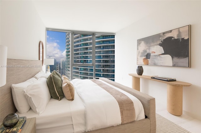 bedroom featuring floor to ceiling windows