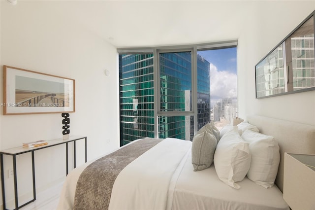 bedroom with a wall of windows