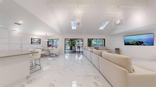 living room featuring an inviting chandelier and high vaulted ceiling