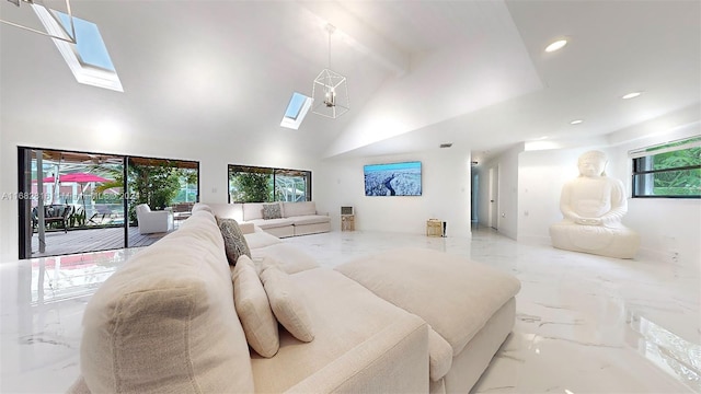 interior space with high vaulted ceiling and a skylight