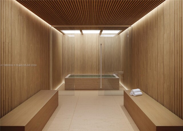 interior space featuring wooden walls