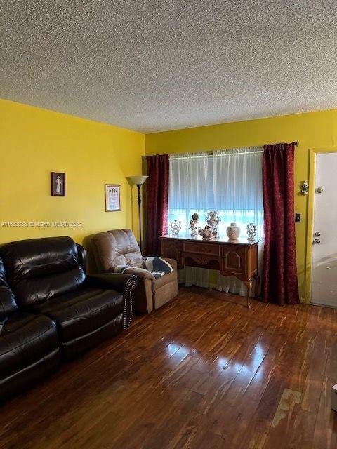 living room featuring dark hardwood / wood-style flooring