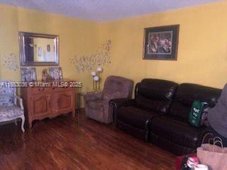 living room featuring dark hardwood / wood-style floors