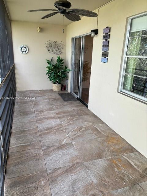 view of patio / terrace featuring ceiling fan