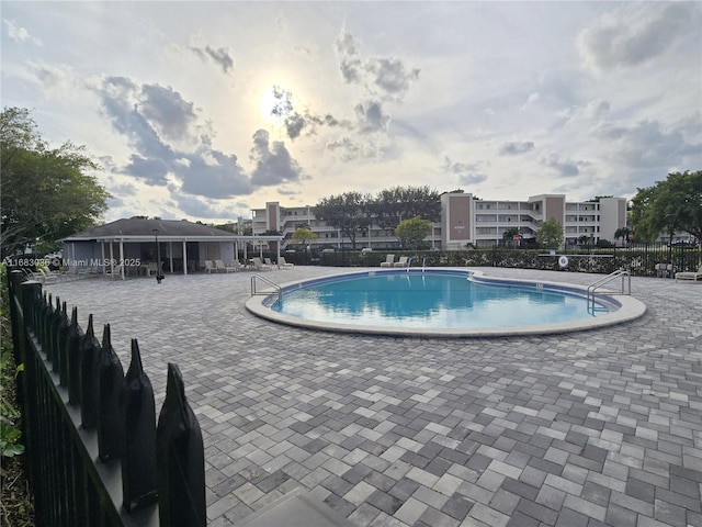 view of swimming pool featuring a patio area