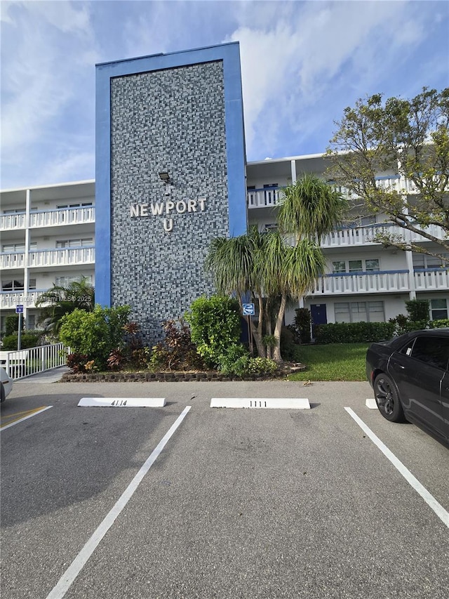 4103 Newport U Unit 4103, Deerfield Beach, FL 33442 - view of building exterior with uncovered parking