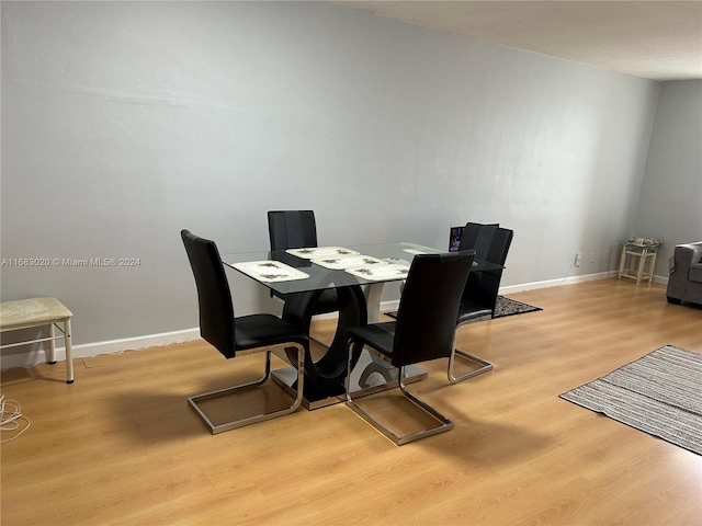 dining room with light hardwood / wood-style flooring