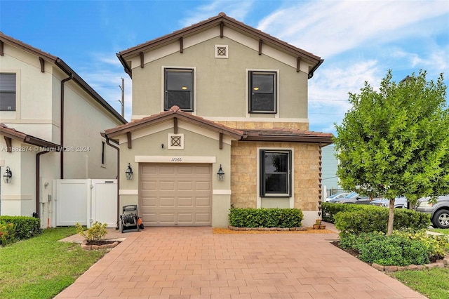 front of property with a garage