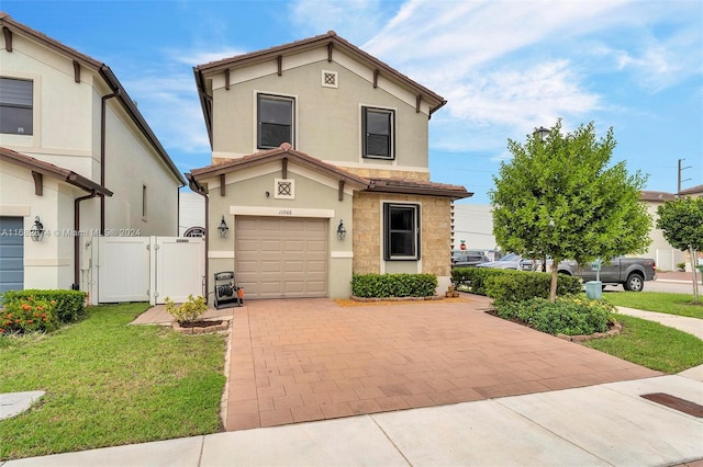 view of front of home with a garage and a front yard