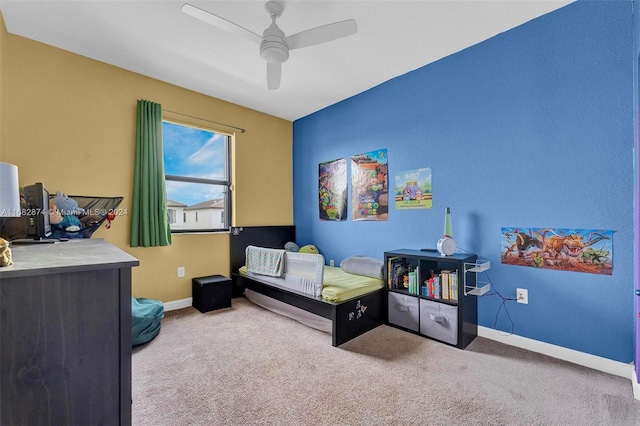 bedroom with ceiling fan and carpet flooring