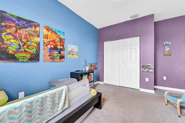 bedroom with carpet and a closet