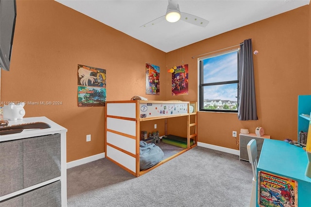 bedroom with ceiling fan and carpet