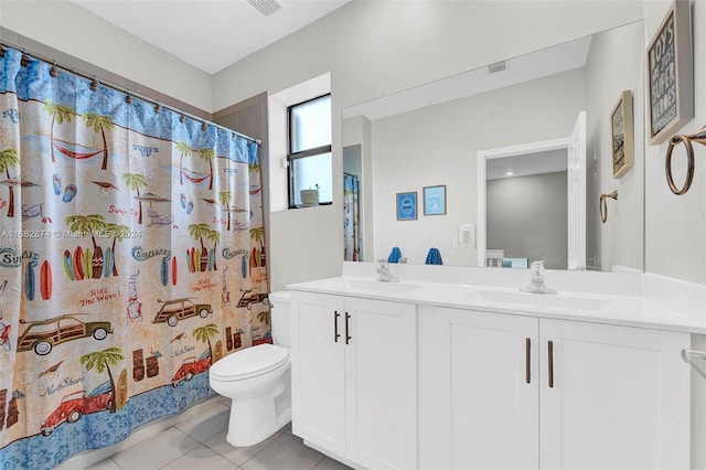 bathroom with a shower with curtain, tile patterned floors, vanity, and toilet