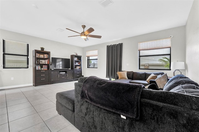 living room with ceiling fan and light tile patterned floors