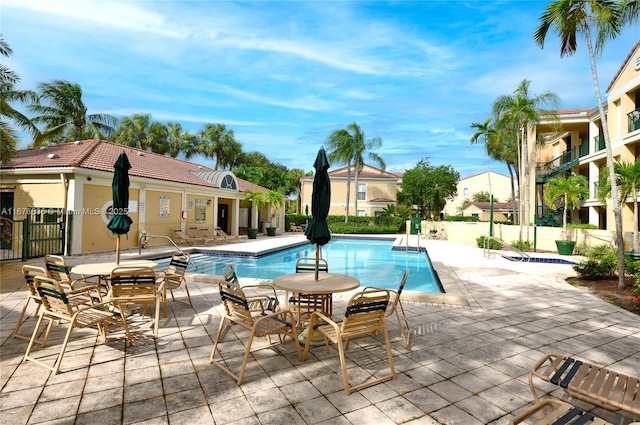 pool featuring a patio and fence