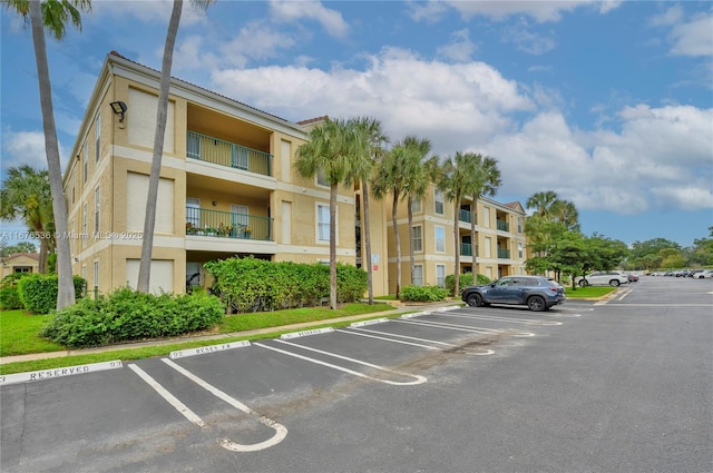view of property featuring uncovered parking