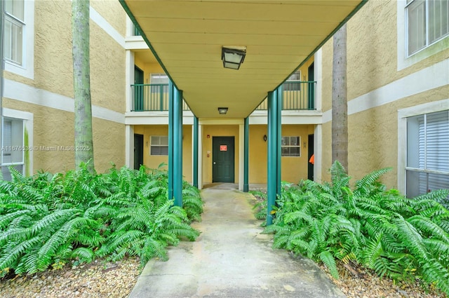 property entrance with stucco siding