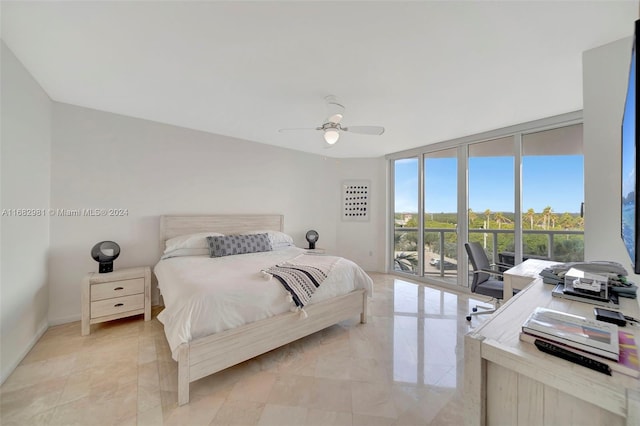 bedroom with expansive windows, access to exterior, and ceiling fan