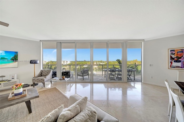 living room featuring expansive windows and ornamental molding