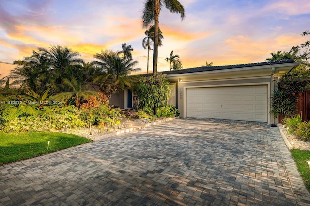 single story home with a garage