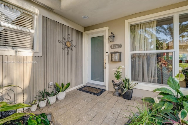 property entrance with a patio