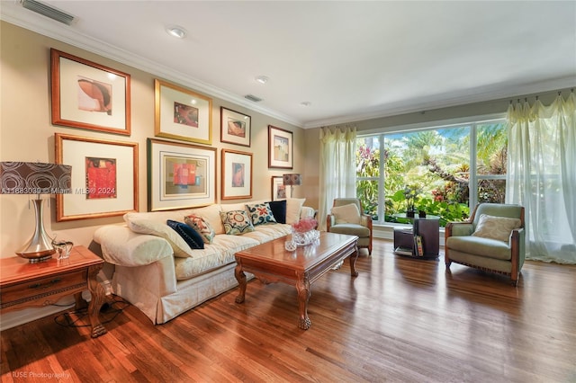 interior space with hardwood / wood-style floors and ornamental molding