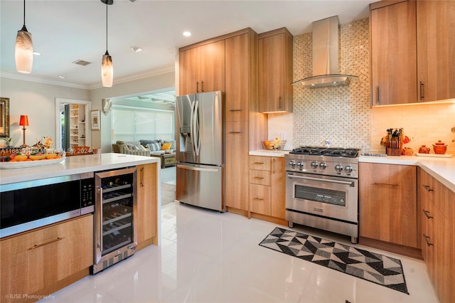 kitchen featuring light tile patterned flooring, wine cooler, appliances with stainless steel finishes, wall chimney exhaust hood, and pendant lighting