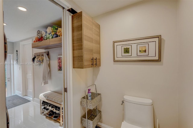 bathroom featuring tile patterned flooring and toilet