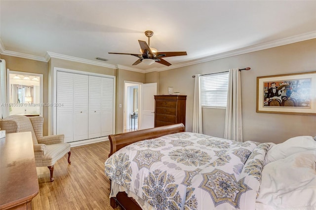 bedroom with a closet, light wood-type flooring, ceiling fan, and crown molding