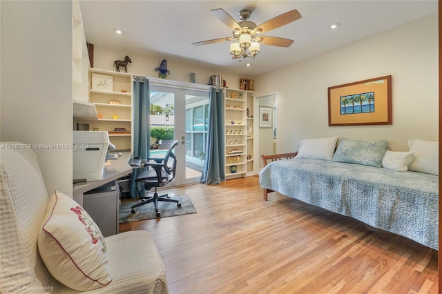 bedroom with ceiling fan, access to exterior, and light wood-type flooring