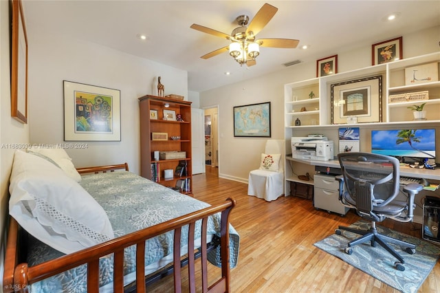 bedroom featuring ceiling fan and light hardwood / wood-style flooring