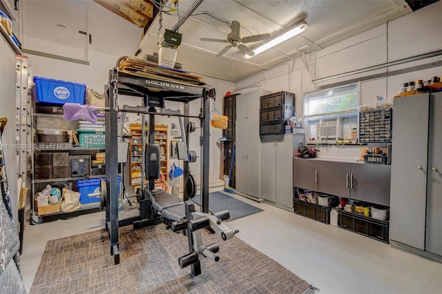 workout area with concrete flooring and ceiling fan