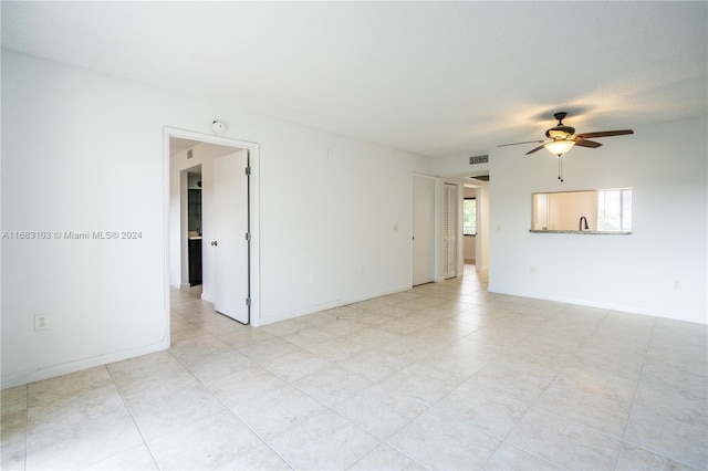 empty room featuring ceiling fan